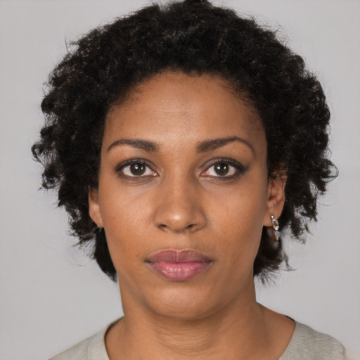 Neutral black young-adult female with medium  black hair and brown eyes
