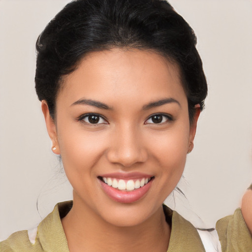 Joyful latino young-adult female with short  brown hair and brown eyes