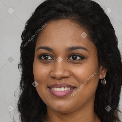 Joyful black young-adult female with long  brown hair and brown eyes