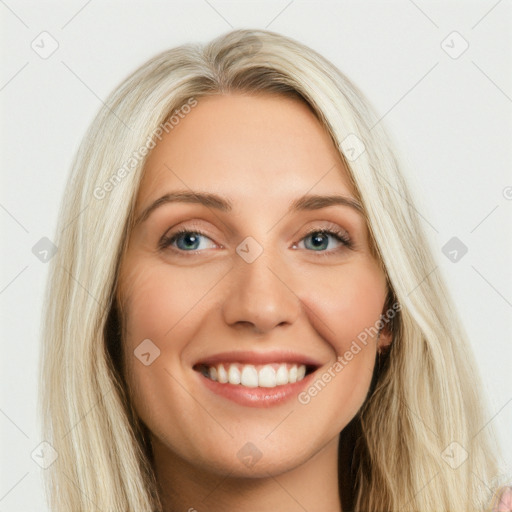 Joyful white young-adult female with long  brown hair and blue eyes