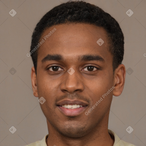 Joyful black young-adult male with short  black hair and brown eyes