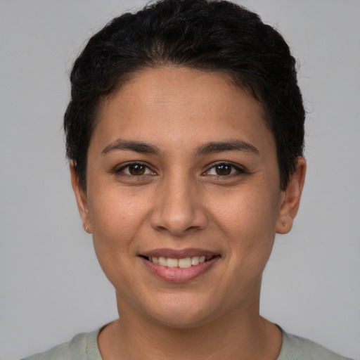 Joyful white young-adult female with short  brown hair and brown eyes