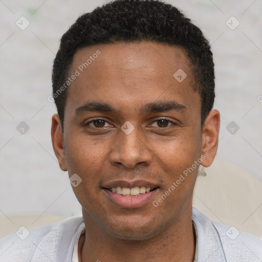 Joyful black young-adult male with short  brown hair and brown eyes