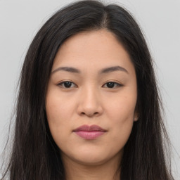 Joyful asian young-adult female with long  brown hair and brown eyes