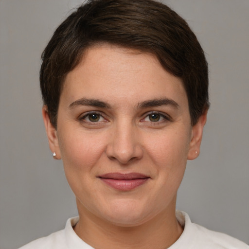 Joyful white young-adult female with short  brown hair and brown eyes