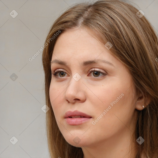 Neutral white young-adult female with long  brown hair and brown eyes