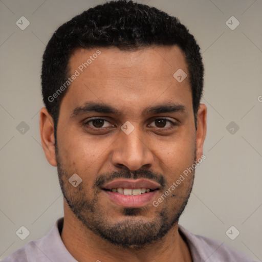 Joyful black young-adult male with short  black hair and brown eyes