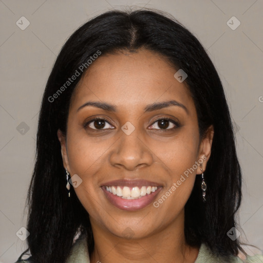 Joyful black young-adult female with long  black hair and brown eyes