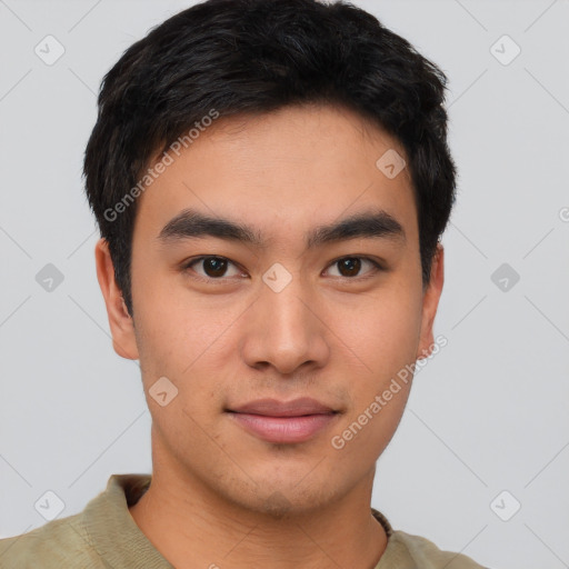 Joyful asian young-adult male with short  brown hair and brown eyes