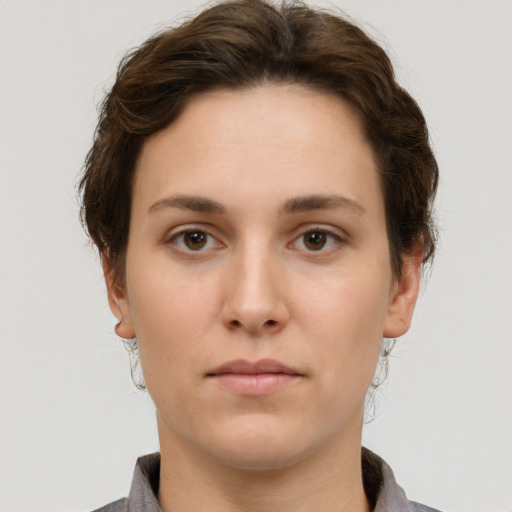 Neutral white young-adult female with short  brown hair and brown eyes