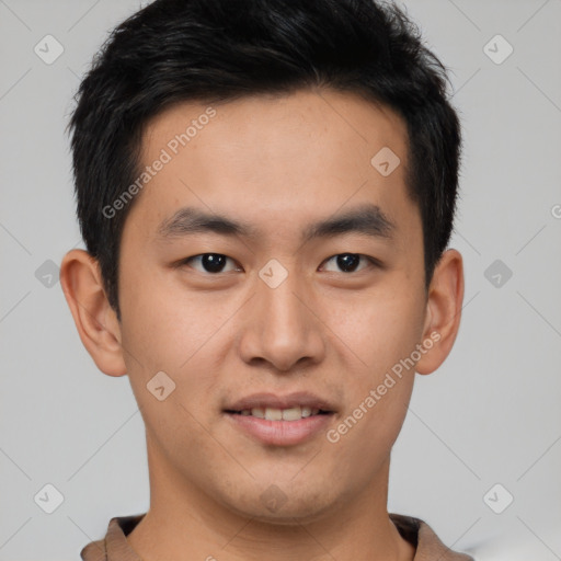 Joyful asian young-adult male with short  brown hair and brown eyes