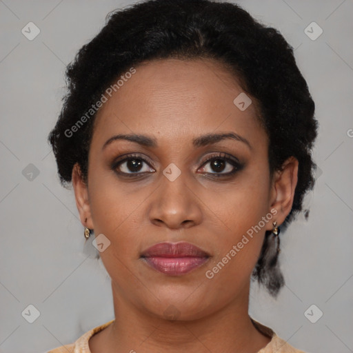 Joyful black young-adult female with short  brown hair and brown eyes