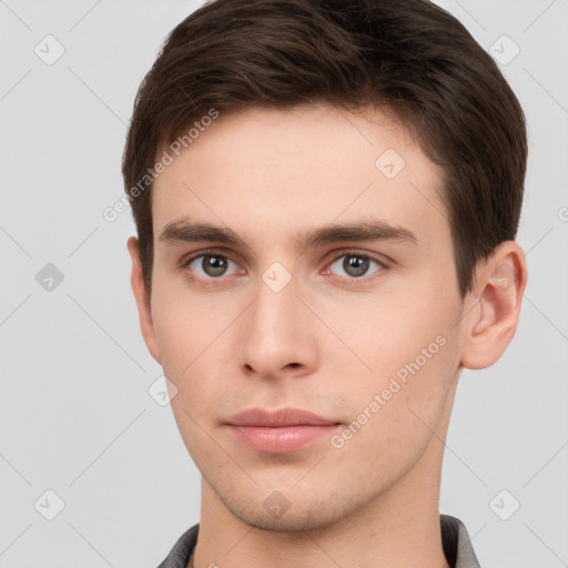 Neutral white young-adult male with short  brown hair and brown eyes