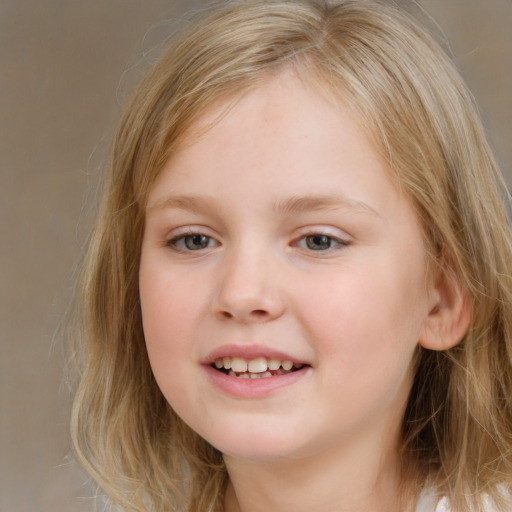 Joyful white child female with medium  brown hair and grey eyes