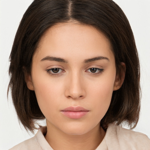 Neutral white young-adult female with medium  brown hair and brown eyes