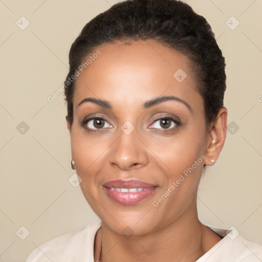 Joyful latino young-adult female with short  black hair and brown eyes