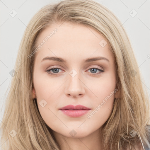 Joyful white young-adult female with long  brown hair and blue eyes