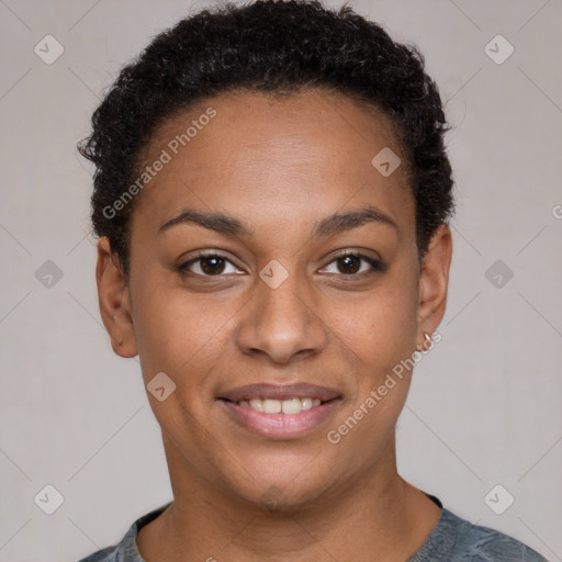 Joyful black young-adult female with short  brown hair and brown eyes