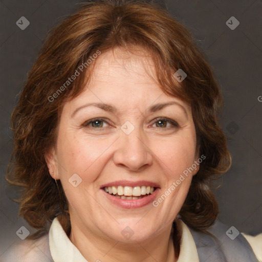 Joyful white adult female with medium  brown hair and grey eyes