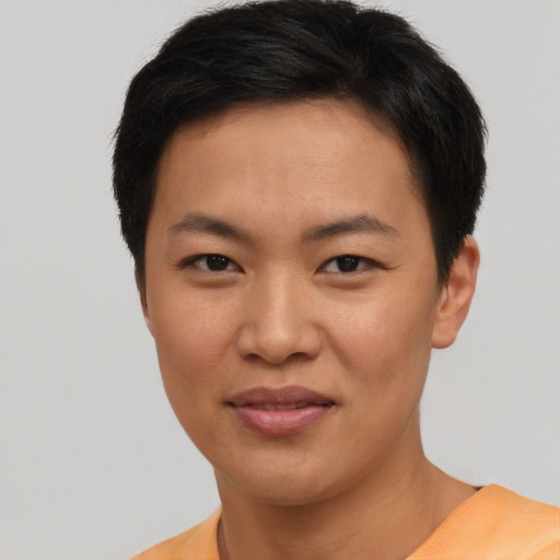 Joyful asian young-adult female with short  black hair and brown eyes