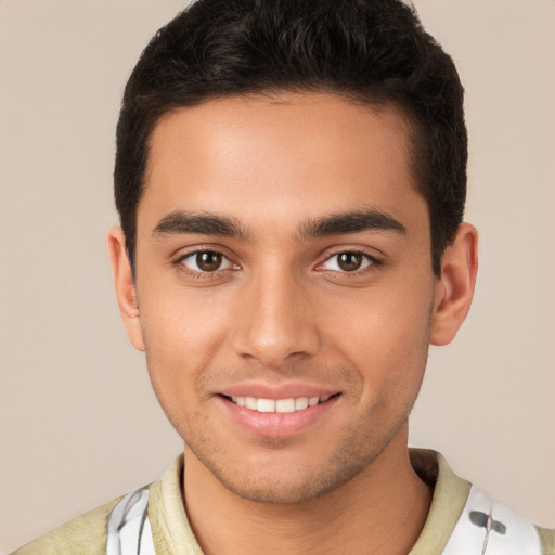 Joyful white young-adult male with short  brown hair and brown eyes