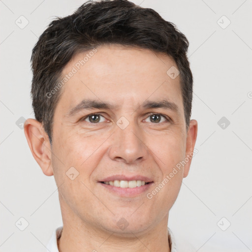 Joyful white adult male with short  brown hair and brown eyes