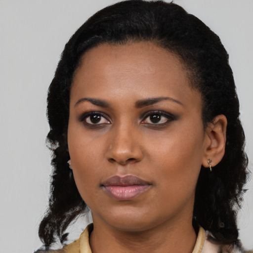Neutral black young-adult female with medium  black hair and brown eyes