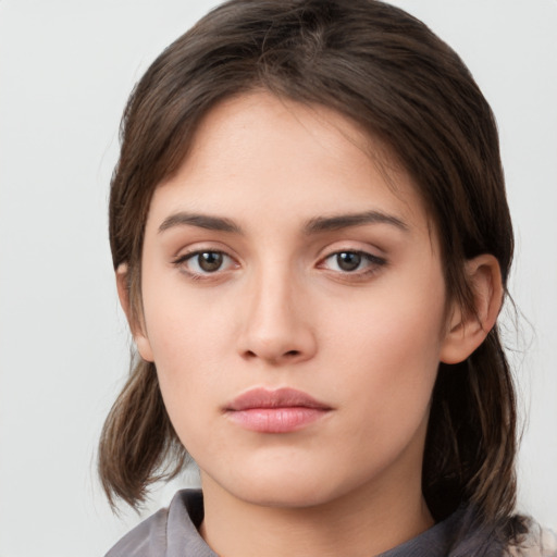 Neutral white young-adult female with medium  brown hair and brown eyes