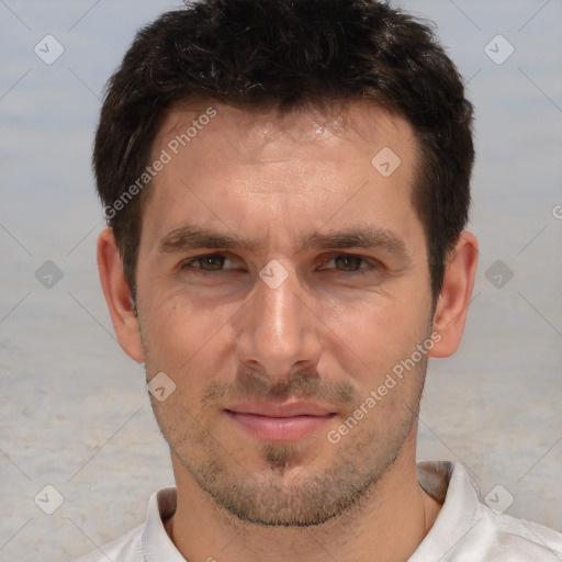 Joyful white adult male with short  brown hair and brown eyes