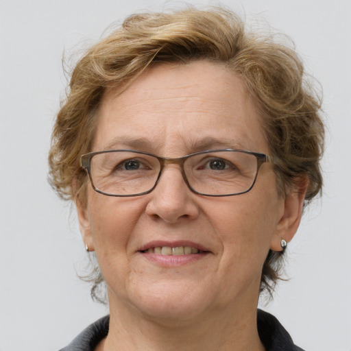 Joyful white middle-aged female with medium  brown hair and grey eyes