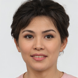 Joyful asian young-adult female with short  brown hair and brown eyes