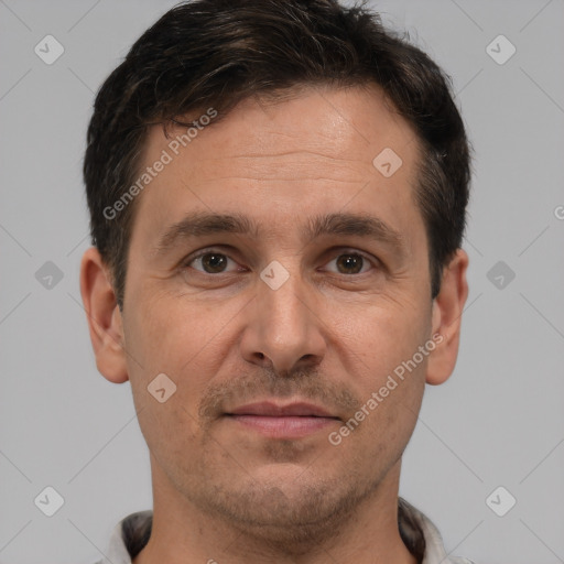 Joyful white adult male with short  brown hair and brown eyes