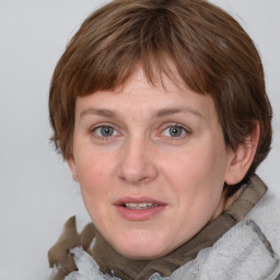 Joyful white young-adult female with medium  brown hair and blue eyes