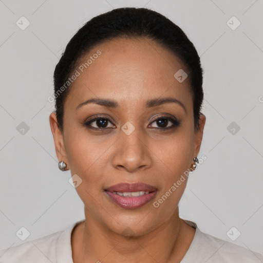 Joyful latino young-adult female with short  black hair and brown eyes