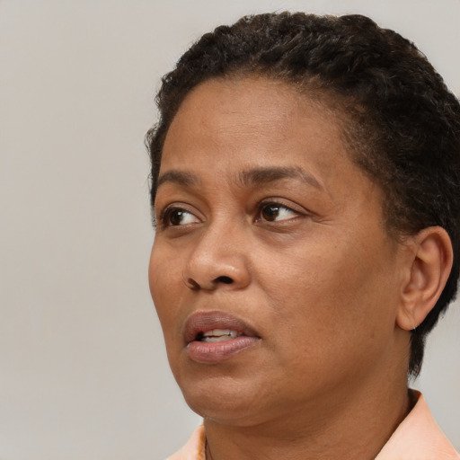 Neutral black adult female with short  brown hair and brown eyes