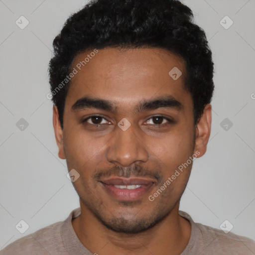 Joyful black young-adult male with short  black hair and brown eyes