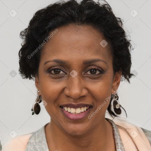 Joyful black adult female with short  brown hair and brown eyes