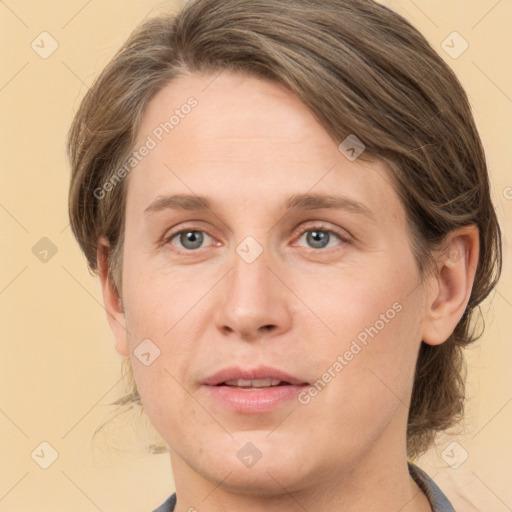 Joyful white adult female with medium  brown hair and grey eyes