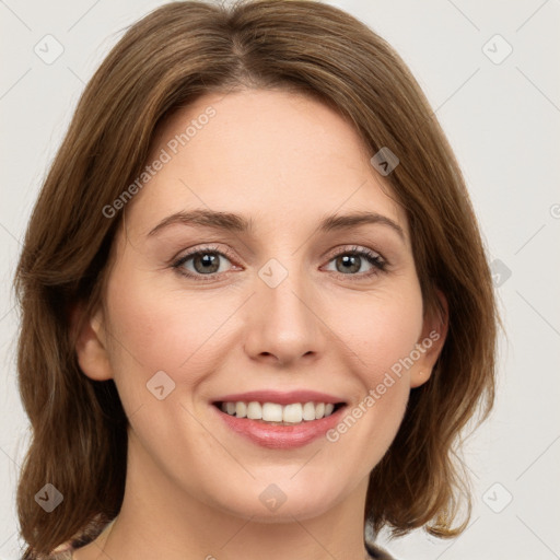 Joyful white young-adult female with medium  brown hair and green eyes