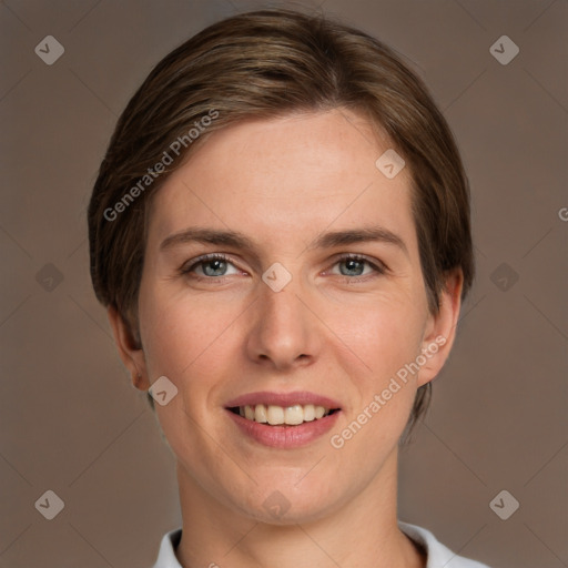 Joyful white young-adult female with short  brown hair and grey eyes