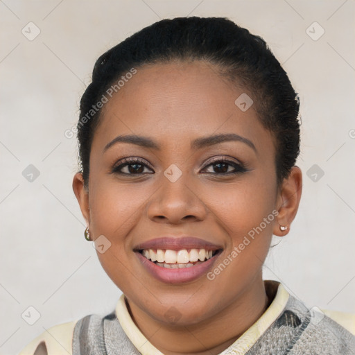 Joyful latino young-adult female with short  black hair and brown eyes