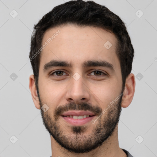 Joyful white young-adult male with short  black hair and brown eyes