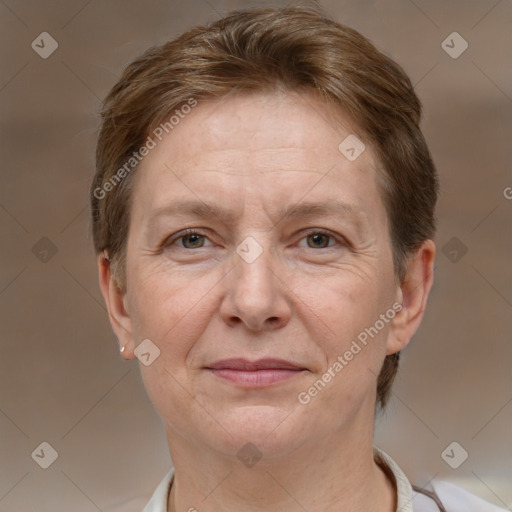 Joyful white adult female with short  brown hair and grey eyes