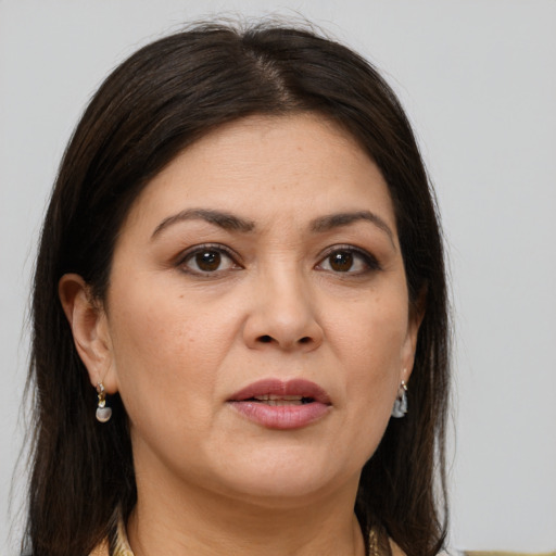 Joyful white adult female with medium  brown hair and brown eyes