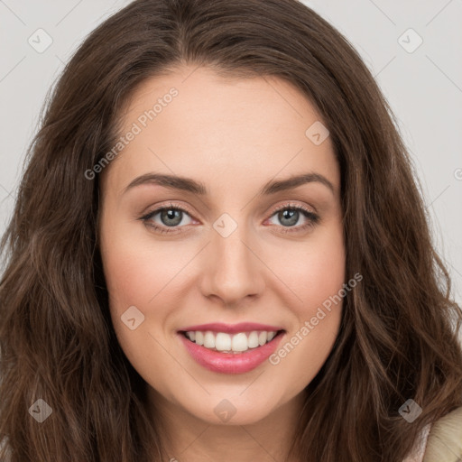 Joyful white young-adult female with long  brown hair and green eyes