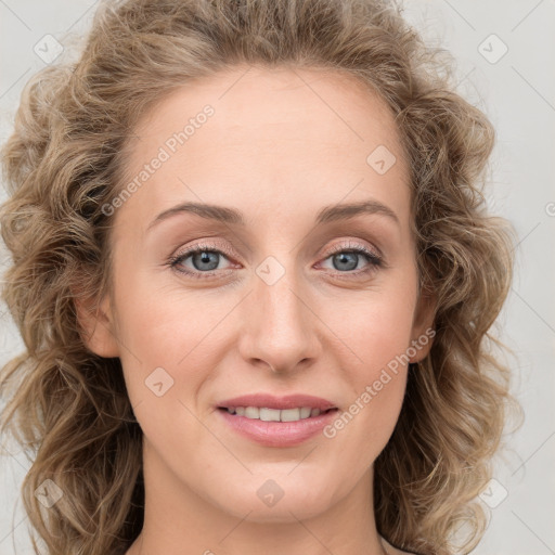 Joyful white young-adult female with long  brown hair and blue eyes