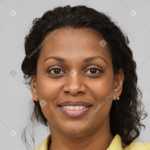 Joyful black young-adult female with medium  brown hair and brown eyes