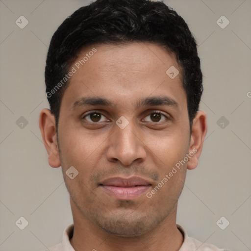 Joyful latino young-adult male with short  black hair and brown eyes