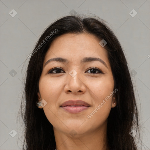 Joyful latino young-adult female with long  brown hair and brown eyes