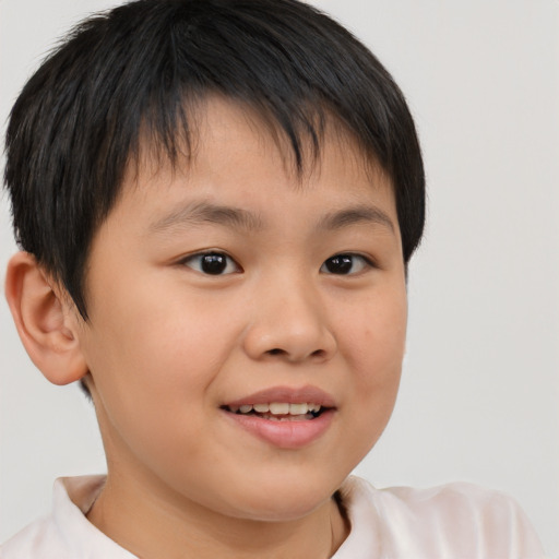Joyful white child male with short  brown hair and brown eyes
